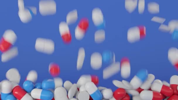 Abstract falling capsules or pills with vitamins or medication inside. Animation. Concept of medicine, pile of pills falling isolated on blue background. — Stock Video