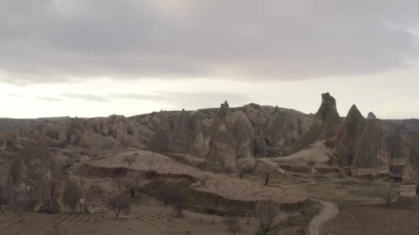 Rocks of Rose valley in Cappadocia, Turkey. Action. Aerial view of a natural breathtaking phenomenon, rock formations valley. — Stock Video