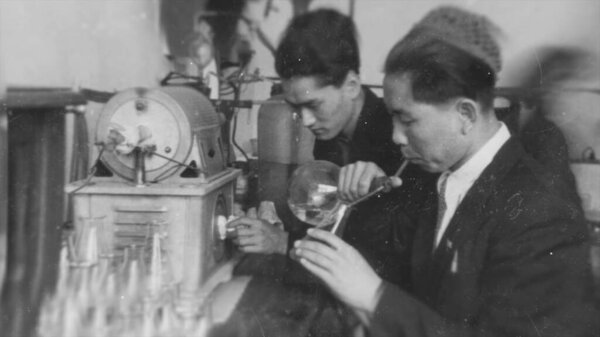 Russia - Ekaterinburg, 04.14.2021: old black and white photos of university students and young scientists in USSR. Stock footage. Clever soviet men and women on retro animated photos.