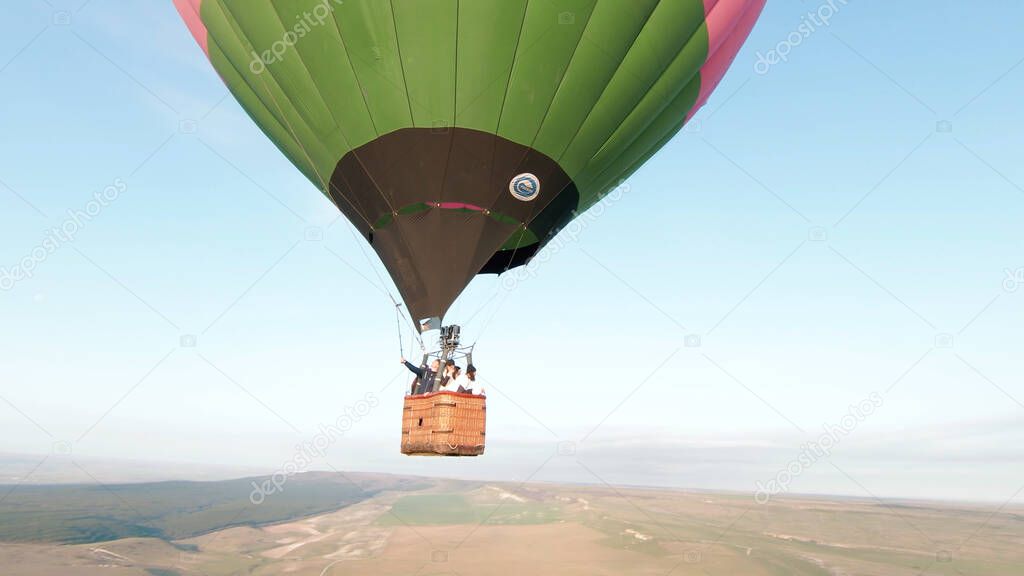 Aerial view of colorful hot air balloon exploring the beautiful summer nature in Asia. Shot. Concept of travelling and extreme.