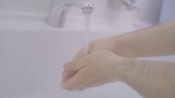 Man carefully washes hands before surgery. Action. Surgeon prepares for operation and washes hands up to elbows. Hygienic procedures of surgeons in hospital before operations — Stock Video