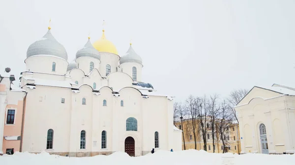 Beautiful ancient white Cathedral of St. Sophia, Novgorod, Russia with the grey and golden domes. Concept. Religion and architecture, old orthodox church building. — Stock Photo, Image