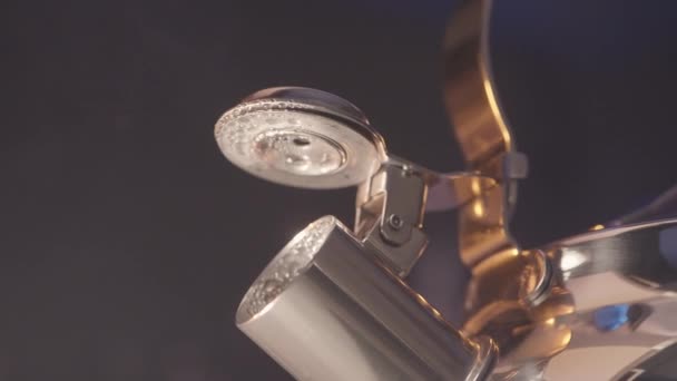 Close up of hot kettle and the steam coming from the spout on blue wall background. Action. Drops of water on a metal teapot spout. — Stock Video