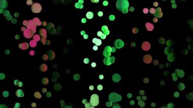 Renkli, parlak, yuvarlak parçacıkların düzenli hareketi siyah zemin üzerinde, pürüzsüz döngü. Hareket. Aynı yöne doğru uçan kaotik eğimli daireler..