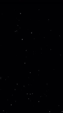 Beyaz parçacıklar yavaşça siyah arkaplana çarpıyor