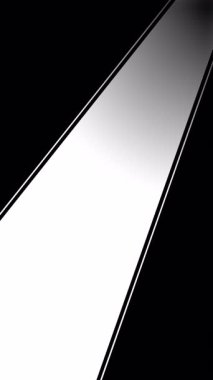 Siyah ve beyaz arkaplanda çapraz ışık demeti genişliyor