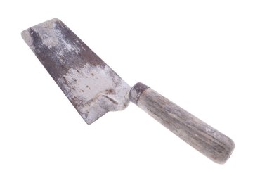 Trowel dirty with mortar. Accessories for construction workers. Light background.