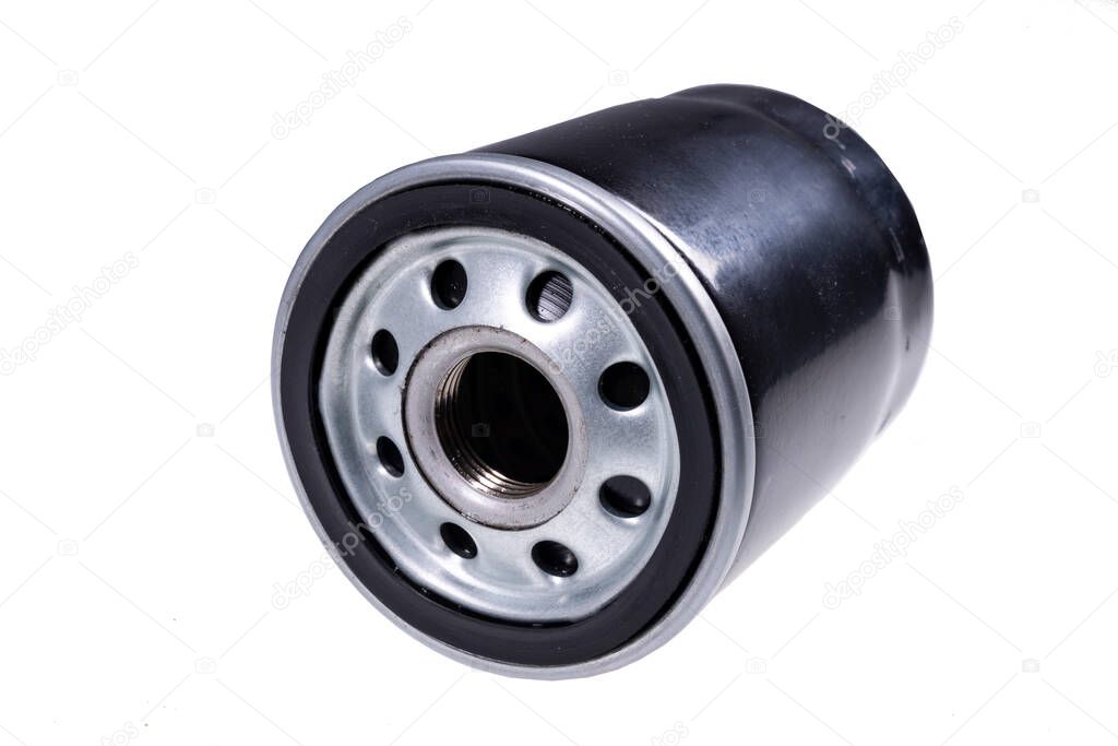 Oil filter used in passenger cars. Parts and accessories for sewing cars with an internal combustion engine. Isolated background.