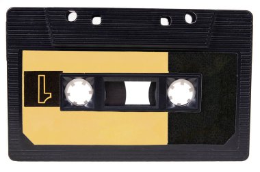 Üzerinde müzik olan eski bir kaset. Müzik kayıtlarını saklamak için aksesuarlar. İzole edilmiş arkaplan.