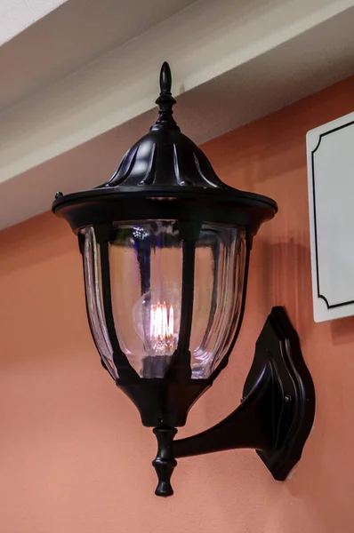 Vintage decorative street lamp on the wall with energy saving LED lamp