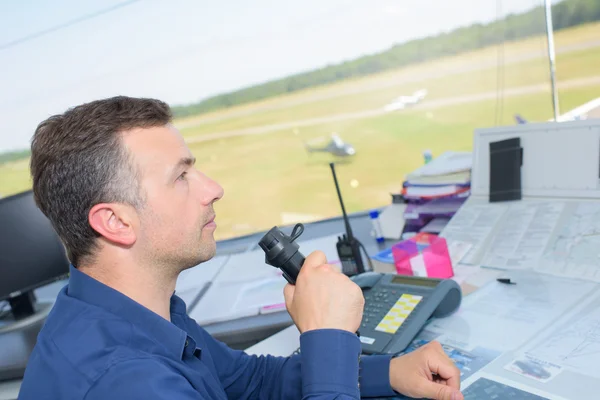 Man talking into control tower receiver — Stock Photo, Image