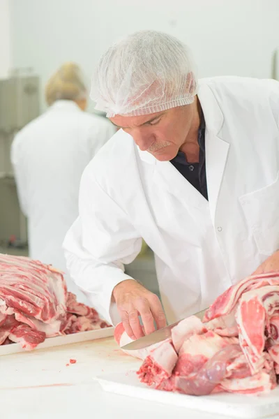 Hombre con carne y hombre — Foto de Stock