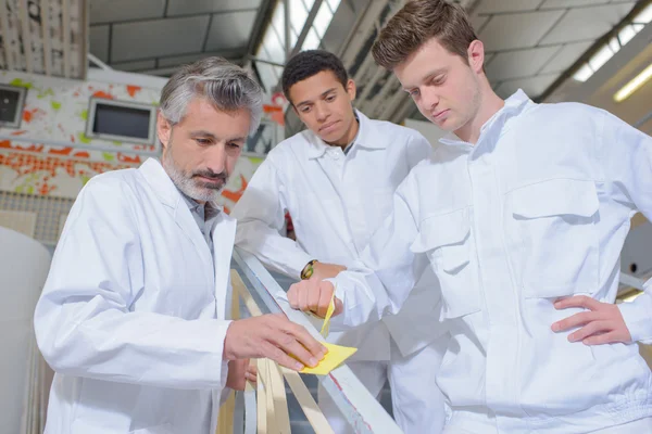 Apprentices observing their teacher — Stock Photo, Image