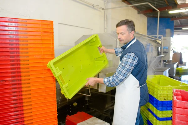 Man stacking crates and middle-aged — Stock Photo, Image