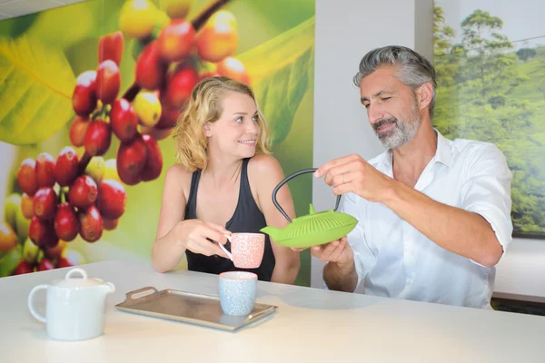 Pouring beverage and man — Stock Photo, Image