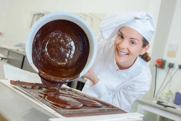 Pouring chocolate and woman — Stock Photo, Image