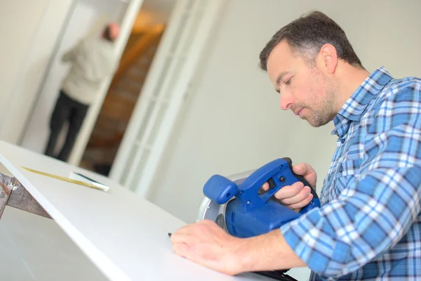 Carpenter using a band saw — Stock Photo, Image