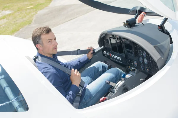 Downward view of pilot in cockpit — Stock Photo, Image