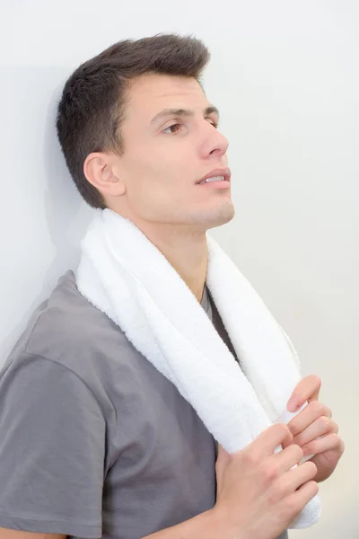 Young man with a towel — Stock Photo, Image