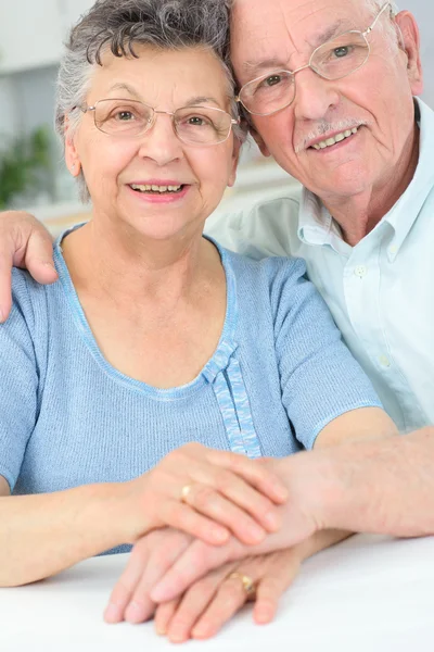 Elderly couple posing and man Stock Picture