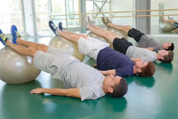 Young men in the gym — Stock Photo, Image