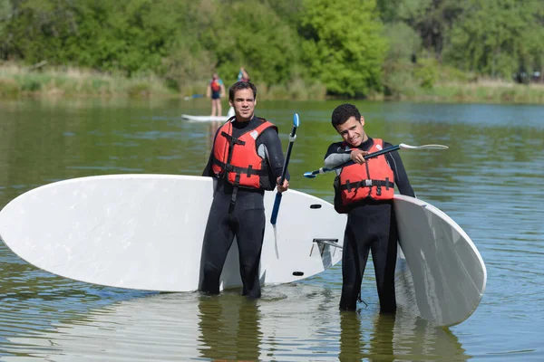 Due Amici Che Fanno Stand Paddle — Foto Stock