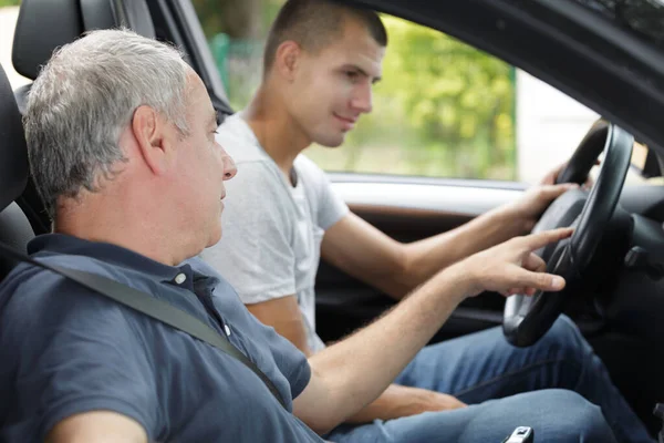 Young Man Having Accompanied Driving Lesson Royalty Free Stock Photos