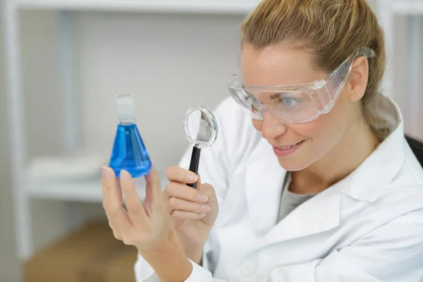 Woman Checking Liquid Magnifying Glass — Stock Photo, Image