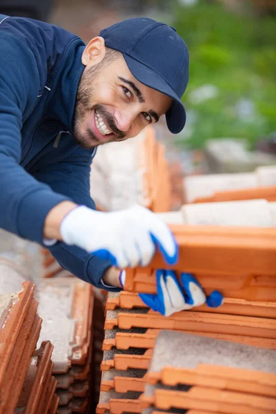 Young Happy Craftsman Carrying Tiles — Stock Photo, Image