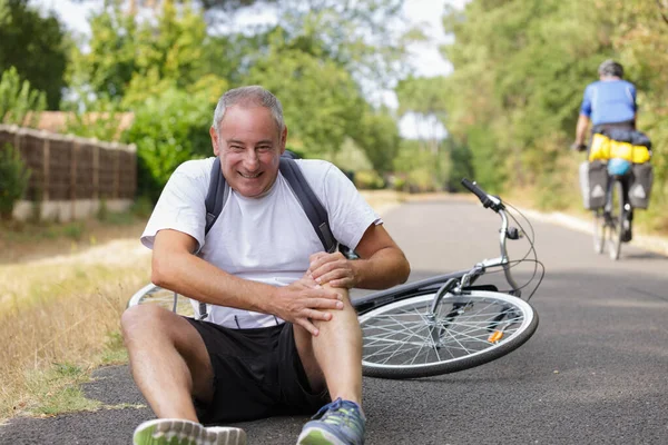 Mature Man Holding Knee Falling Bicycle — Stock Photo, Image