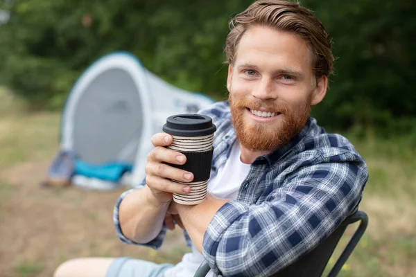 Hipster Man Sits Folding Chair Campsite Drinking Coffee — Stock Photo, Image