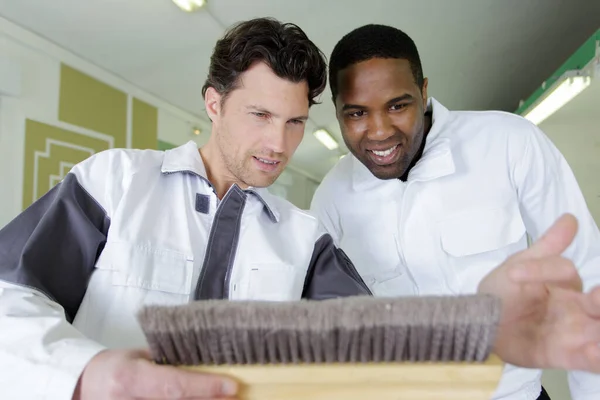 Happy Colleagues Checking Brush — Stock Photo, Image
