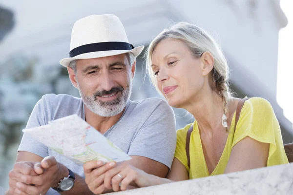 lovely couple looking at map