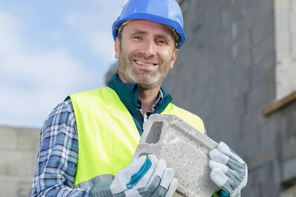 Strong Builder Carrying Building Block — Stock Photo, Image