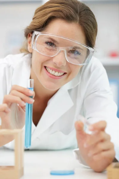 Happy Young Attractive Female Scientist Holding Flask — Stock Photo, Image