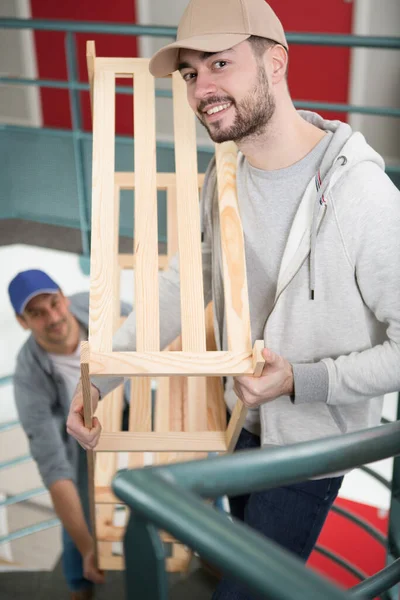 Two Men Carrying New Furniture — Stock Photo, Image