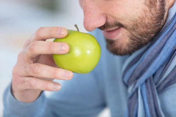 Young Man Smelling Apple — Stock Photo, Image