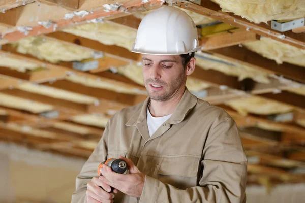 Builder Checking Drill — Stock Photo, Image
