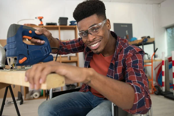 Happy Man Cutting Wood Jigsaw — Stock Photo, Image