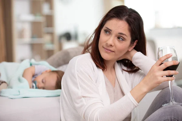 Depressed Mother Drinking Wine Baby Background — Stock Photo, Image