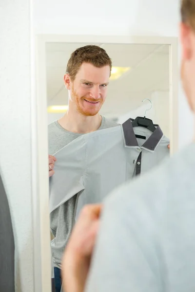 Happy Man Tries Shirt Clothing Fashion Store — Stock Photo, Image