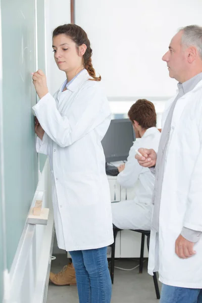 Young Women Scientist Writing Green Board — Stock Photo, Image