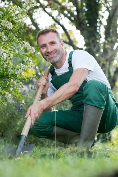 gardener with boots resting working outdoors