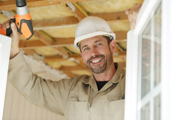 portrait of a smiling window fitter