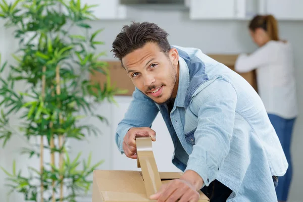 Man Taping Boxes Moving New Apartment — Stock Photo, Image