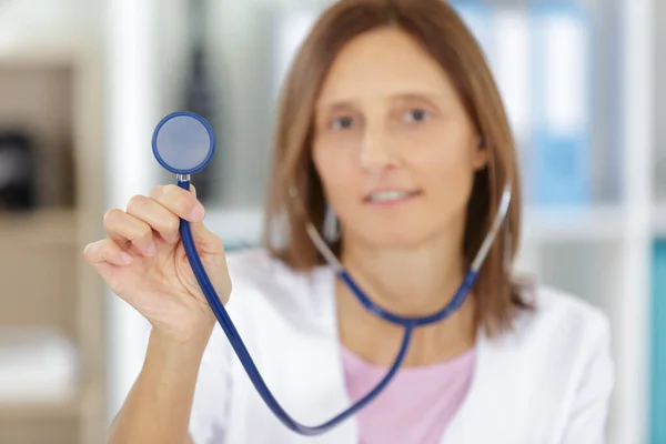 Doctor Holding Stethoscope Stock Photo