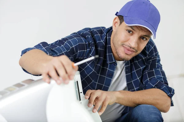 Man Repairing Air Conditioning Unit Screwdriver — Photo