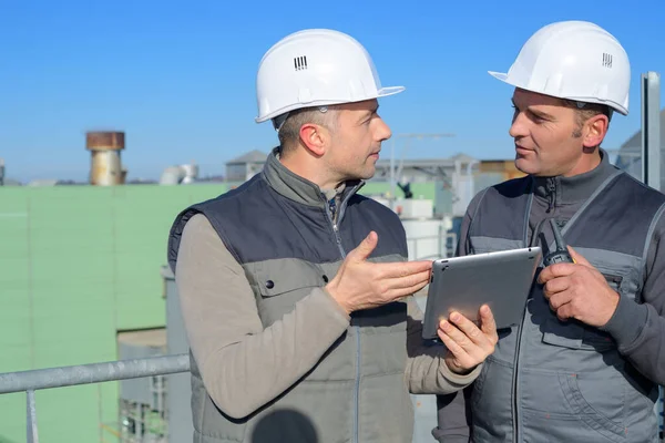 Two Construction Workers Using Tablet — Stok fotoğraf