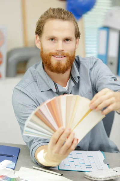 Young Man Holding Color Swatch Painter Painting — Foto de Stock