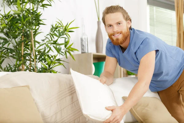 Dry Cleaning Worker Fixing Sofa Indoors — Stok fotoğraf